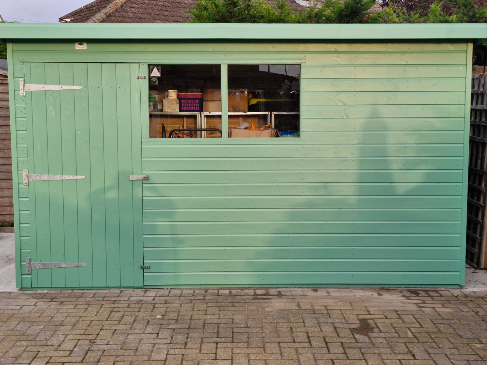Green painted garden shed