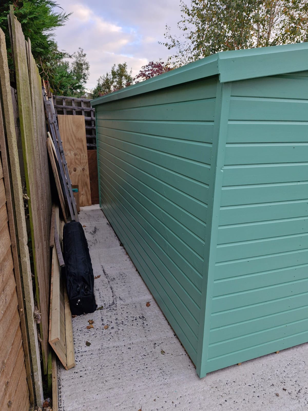 Turquoise painted shed wall