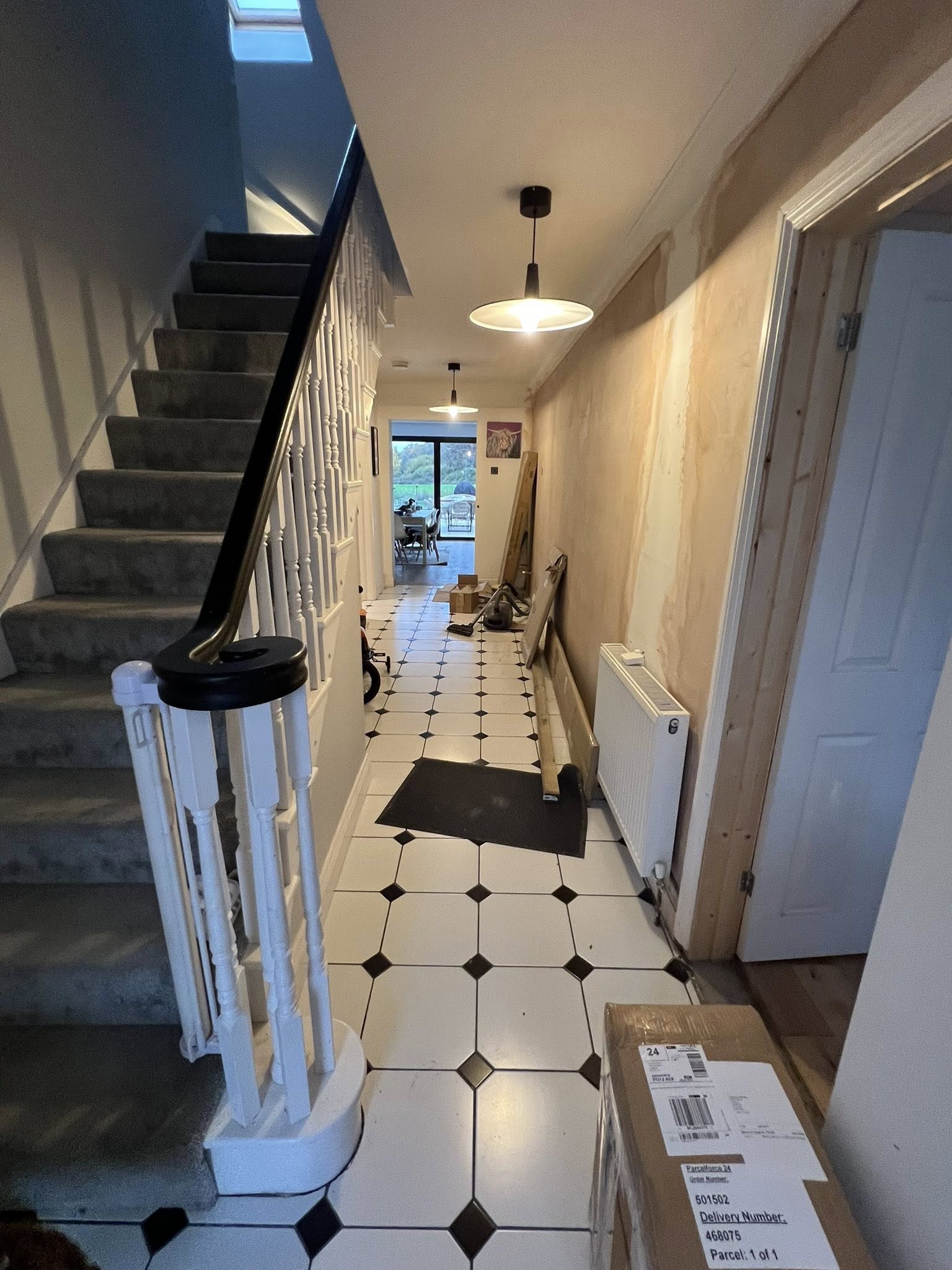 Hallway with geometric tile flooring
